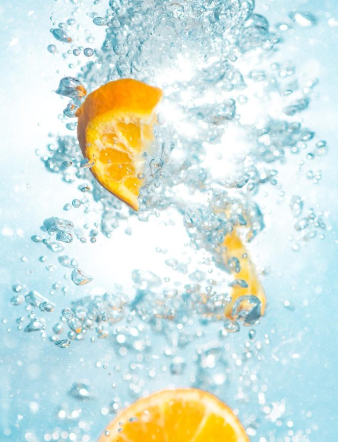 Unsplashed Photo for Judge Jade Column. A picture of an orange in water. 