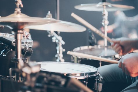An image of a drum set that is being played. 